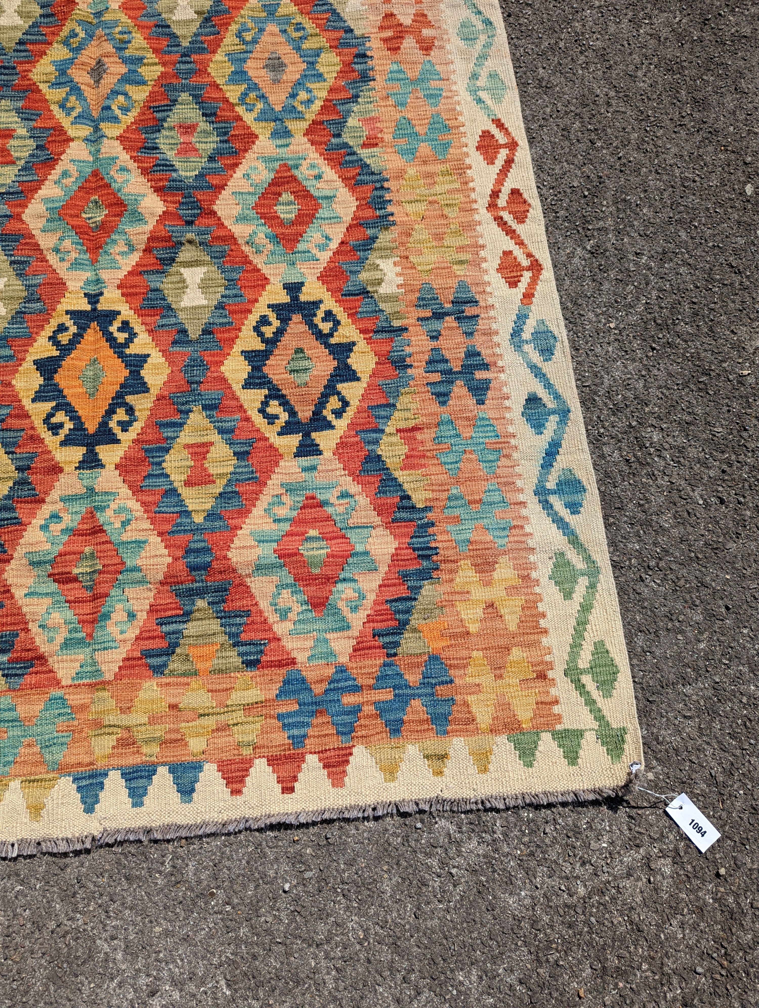 An Anatolian design polychrome geometric flatweave carpet, 196 x 156cm